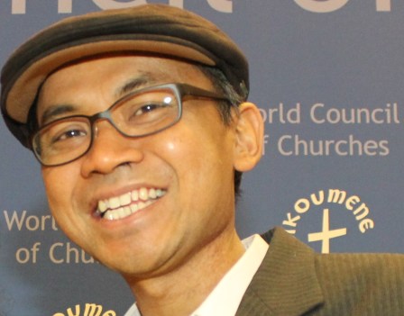 Muridan Widjodo at the International Coalition for Papua conference, World Council of Churches, Geneva, September 2013 (Photo: West Papua Media) 